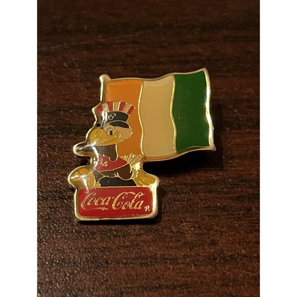 Vintage 1984 Los Angeles Olympics Coca Cola Sam Eagle Ivory Coast Flag Lapel Pin - Picture 1 of 3